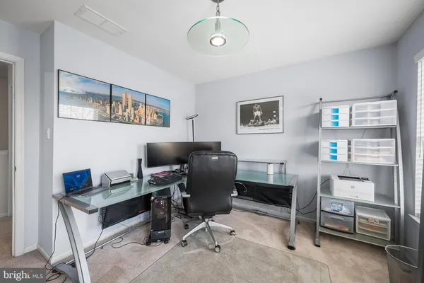 a view of a workspace with furniture