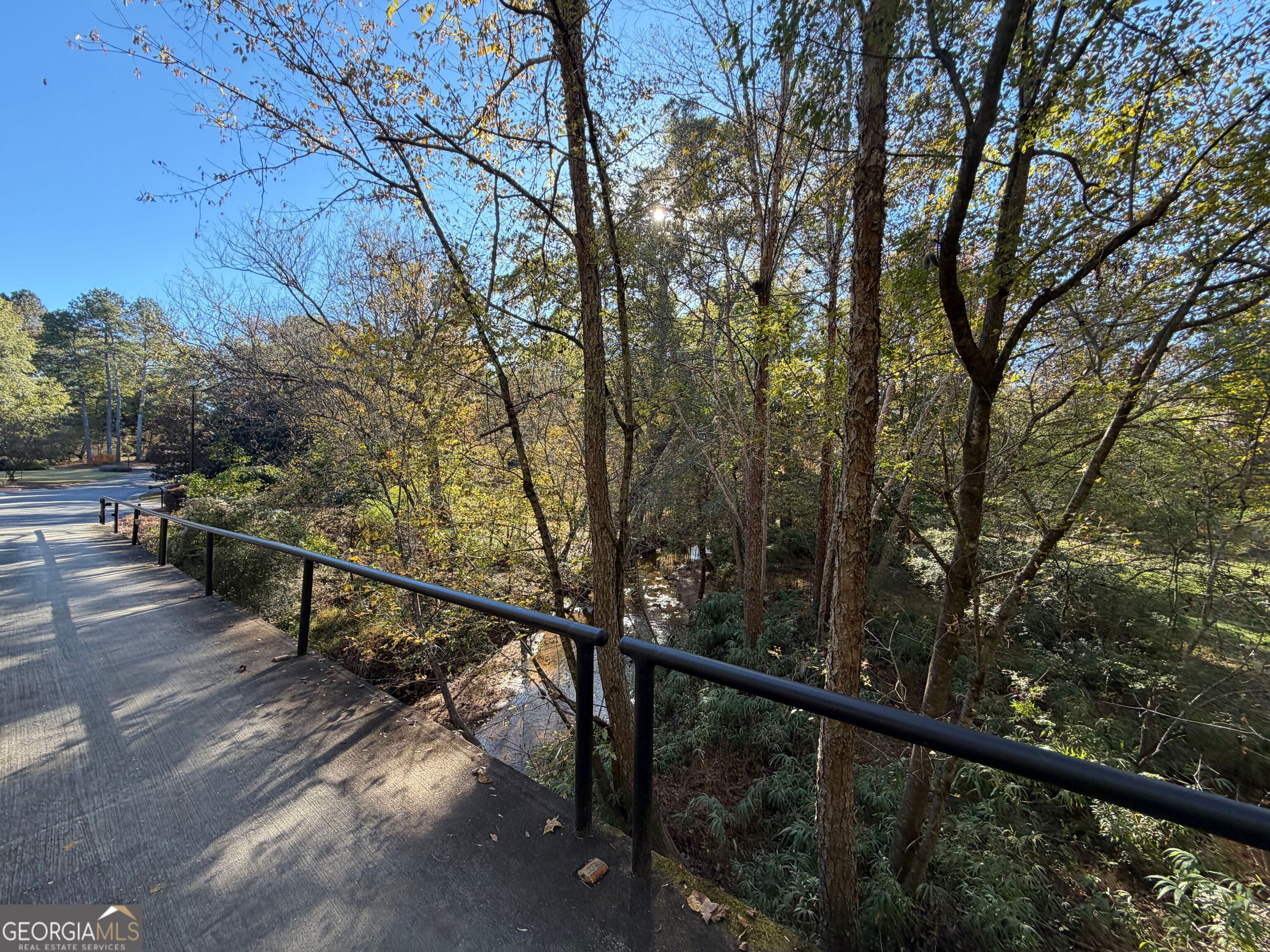 117 Covington Place Athens, GA 30606 - Photo 30 of 33 a view of a balcony with wooden fence and trees