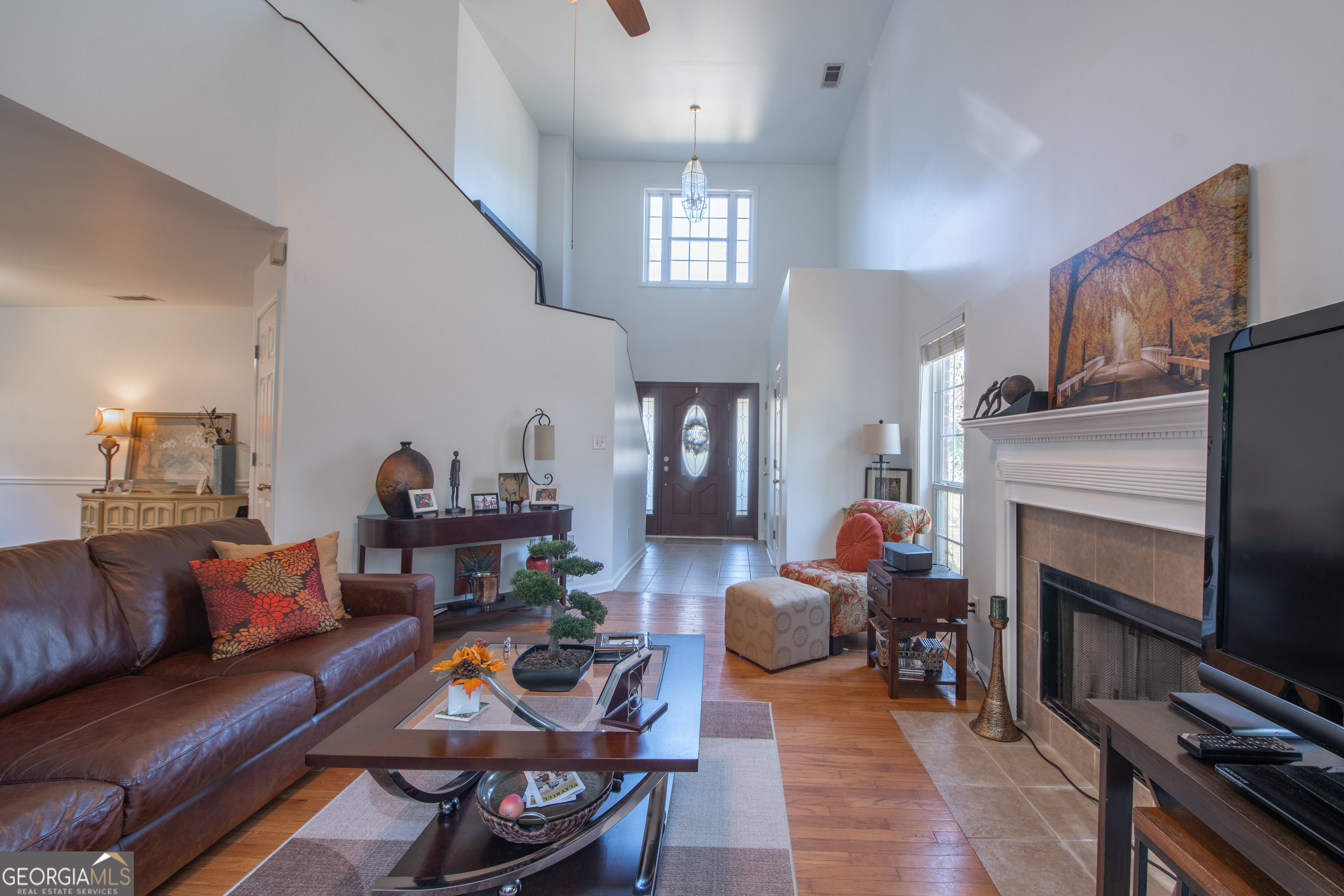117 Covington Place Athens, GA 30606 - Photo 5 of 33 a living room with furniture a fireplace and a flat screen tv