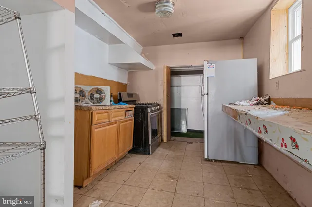 a utility room with cabinets dryer and washer