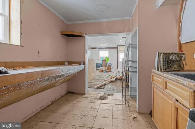 a spacious bathroom with a granite countertop sink and a bath tub