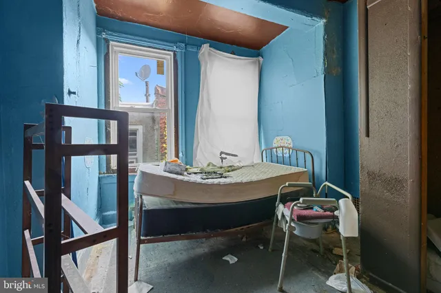 a view of a dining room with furniture and a window