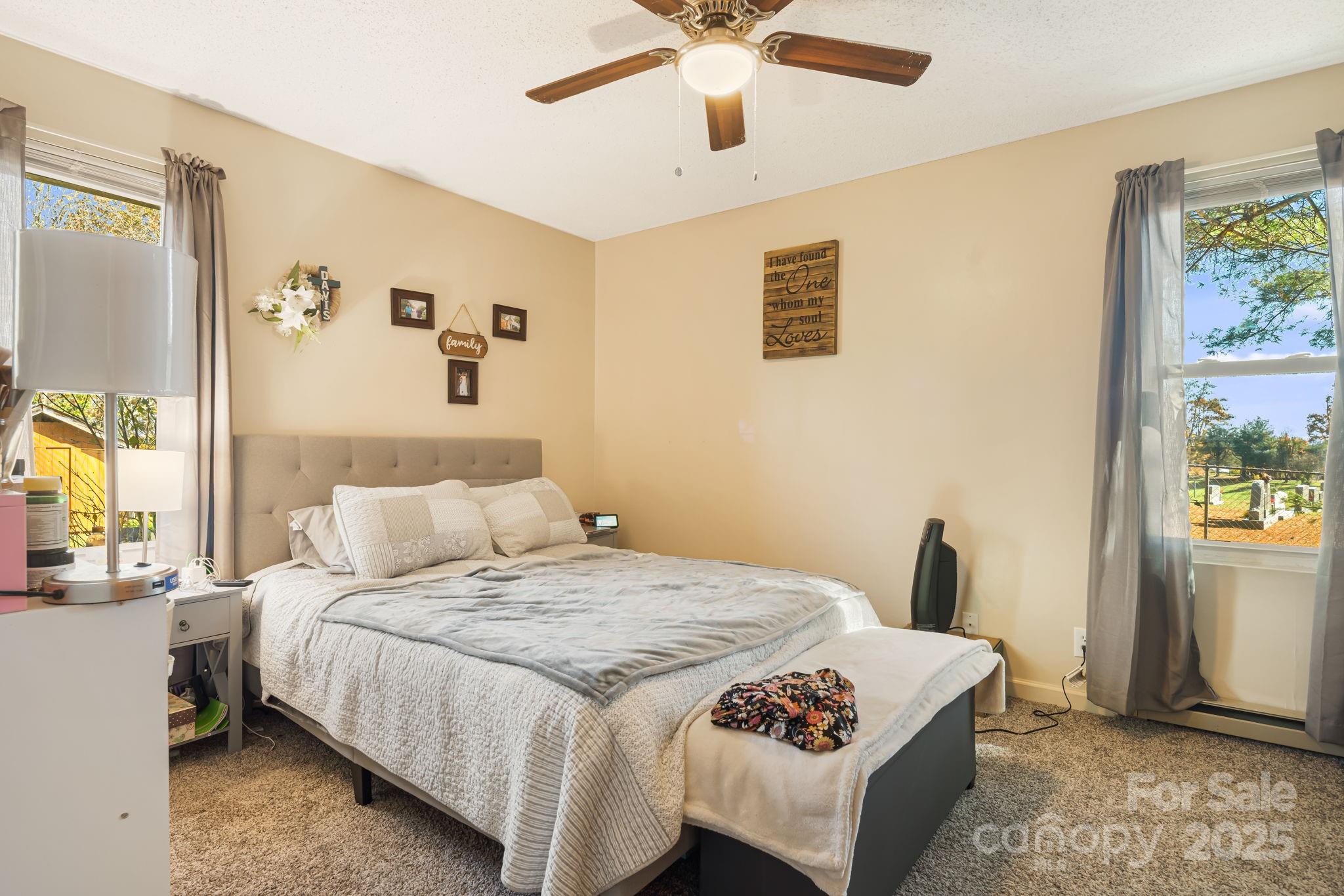 645 Flint Hill Road Alexander, NC 28701 - Photo 23 of 30 a bedroom with a bed and a window