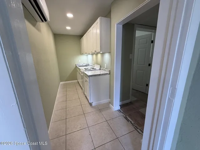 a kitchen with stainless steel appliances a sink and a refrigerator