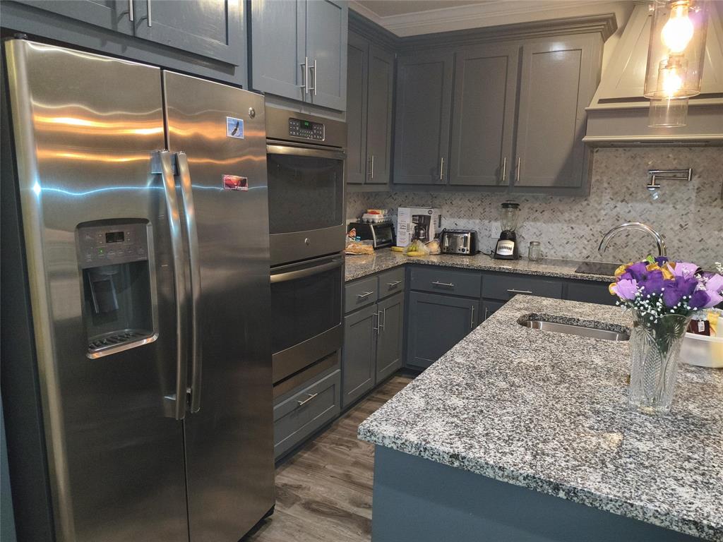 3027 Ames Road Lancaster, TX 75134 - Photo 11 of 35 Kitchen featuring double oven
