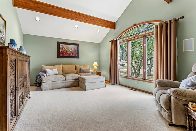 a living room with furniture and a window