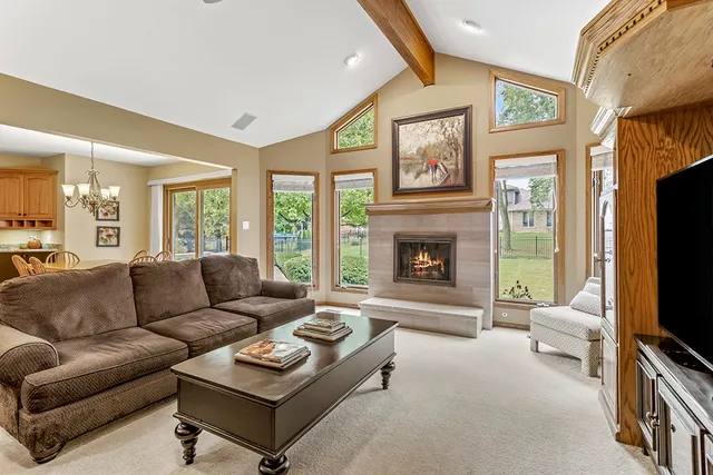 a living room with furniture flat screen tv and a fireplace