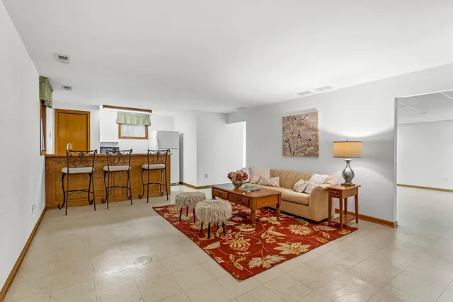 a living room with furniture and a table