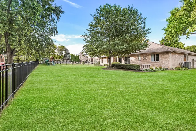 a view of a house with a big yard