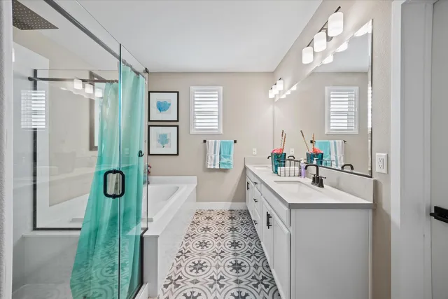 a bathroom with a double vanity sink and a mirror