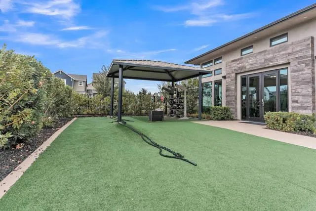 a view of a backyard with sitting area