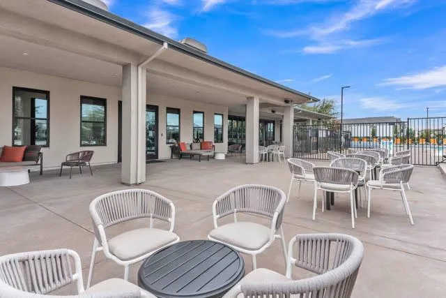 a view of swimming pool with outdoor seating