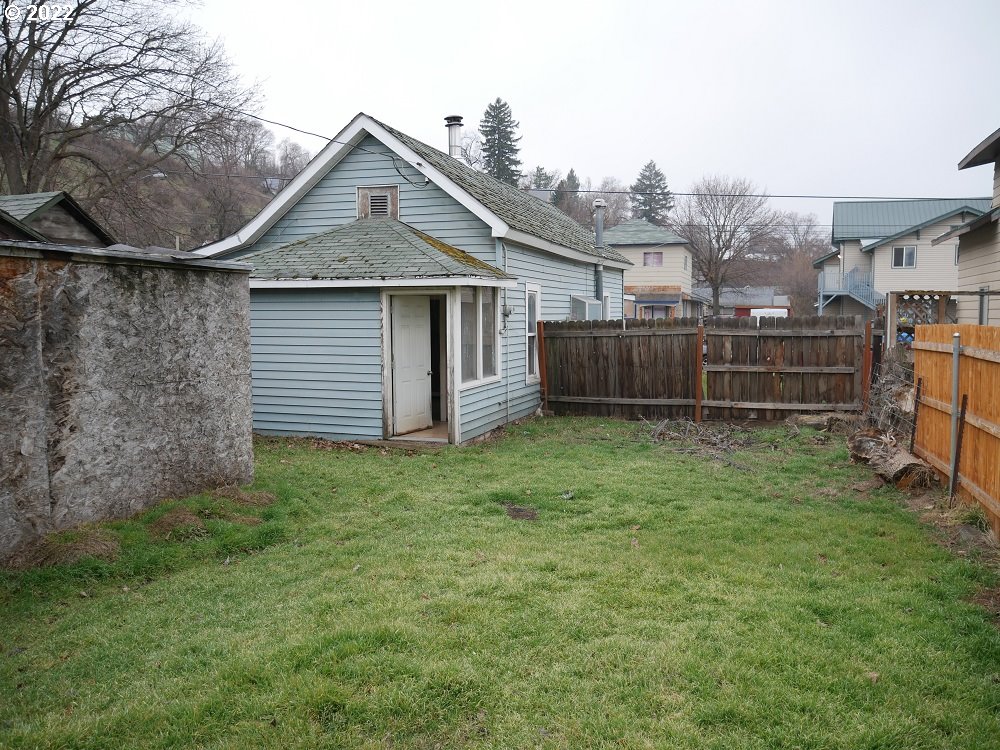 628 Southwest 4th Street Pendleton, OR 97801 - Photo 5 of 15 a view of a house with a backyard