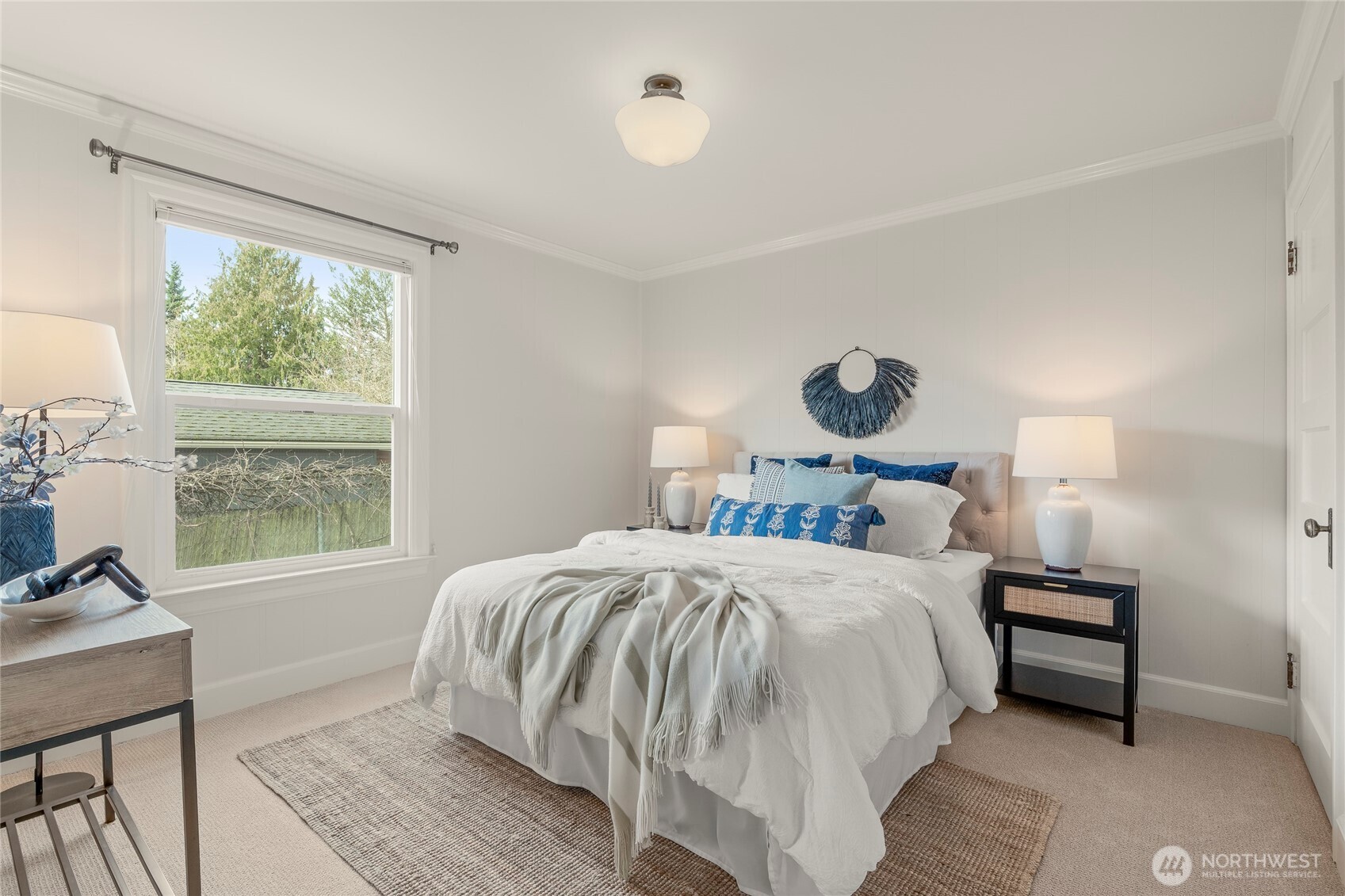 910 Northwest 64th Street Seattle, WA 98107 - Photo 15 of 31 a bedroom with a bed and a large window