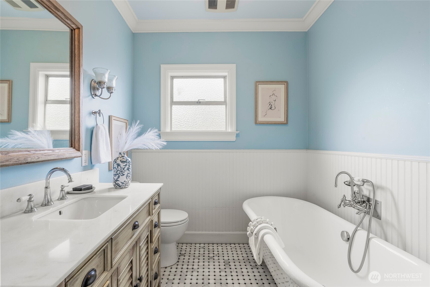 910 Northwest 64th Street Seattle, WA 98107 - Photo 16 of 31 a bathroom with a sink and a mirror