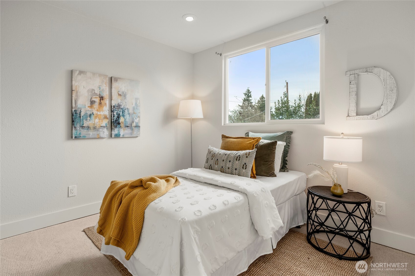 910 Northwest 64th Street Seattle, WA 98107 - Photo 17 of 31 a bedroom with bed and window
