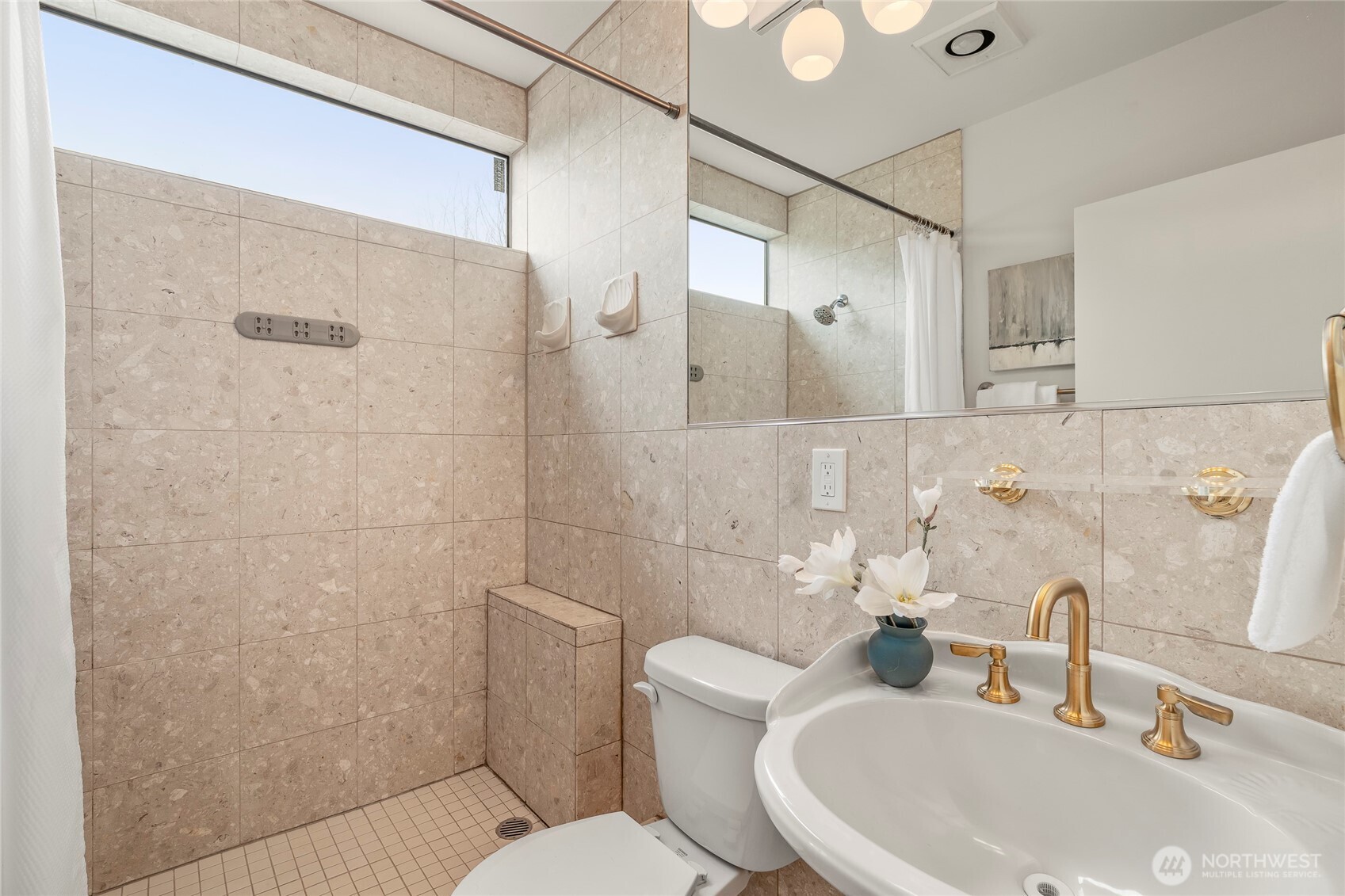910 Northwest 64th Street Seattle, WA 98107 - Photo 18 of 31 a bathroom with a sink toilet and shower