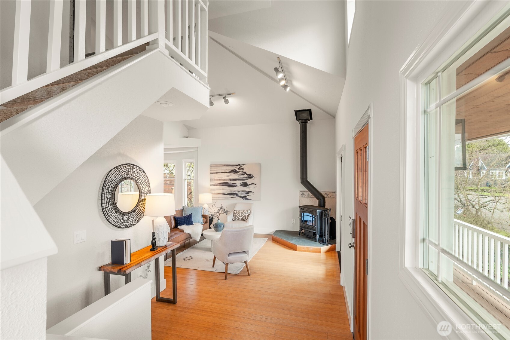 910 Northwest 64th Street Seattle, WA 98107 - Photo 19 of 31 a living room with furniture a rug and a large window