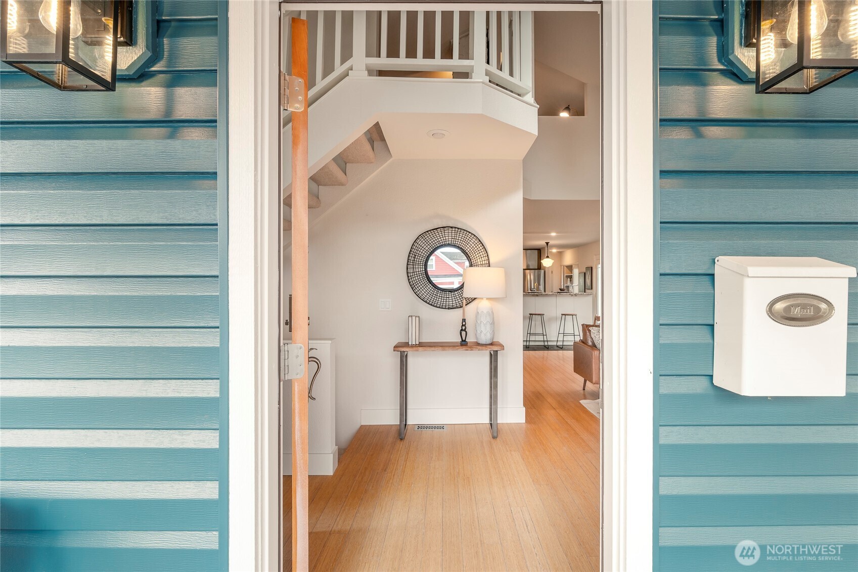 910 Northwest 64th Street Seattle, WA 98107 - Photo 8 of 31 a view of a kitchen cabinets and a wooden floor