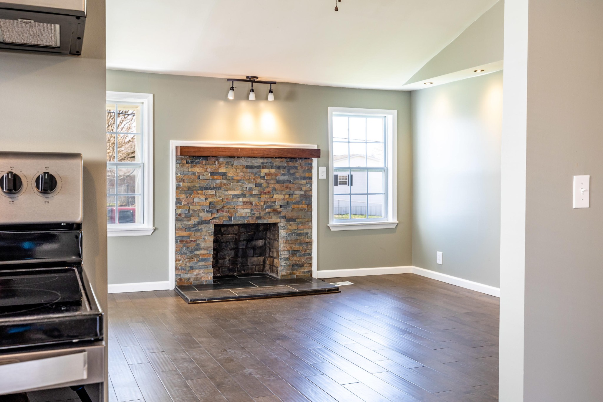 804 Spring Street Philadelphia, TN 37846 - Photo 17 of 33 a living room with wooden floor and a fireplace