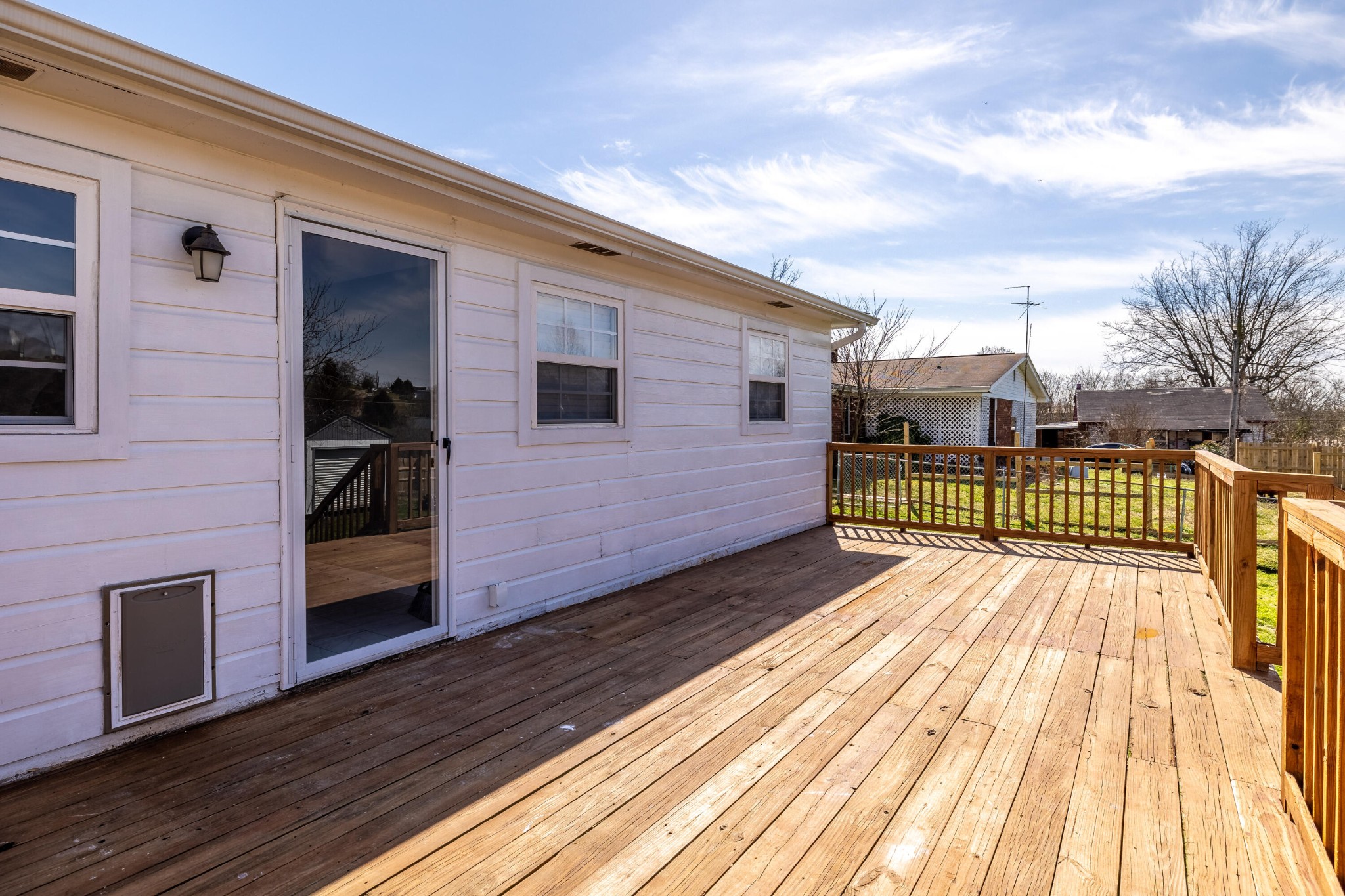804 Spring Street Philadelphia, TN 37846 - Photo 26 of 33 a view of a wooden deck besides a yard