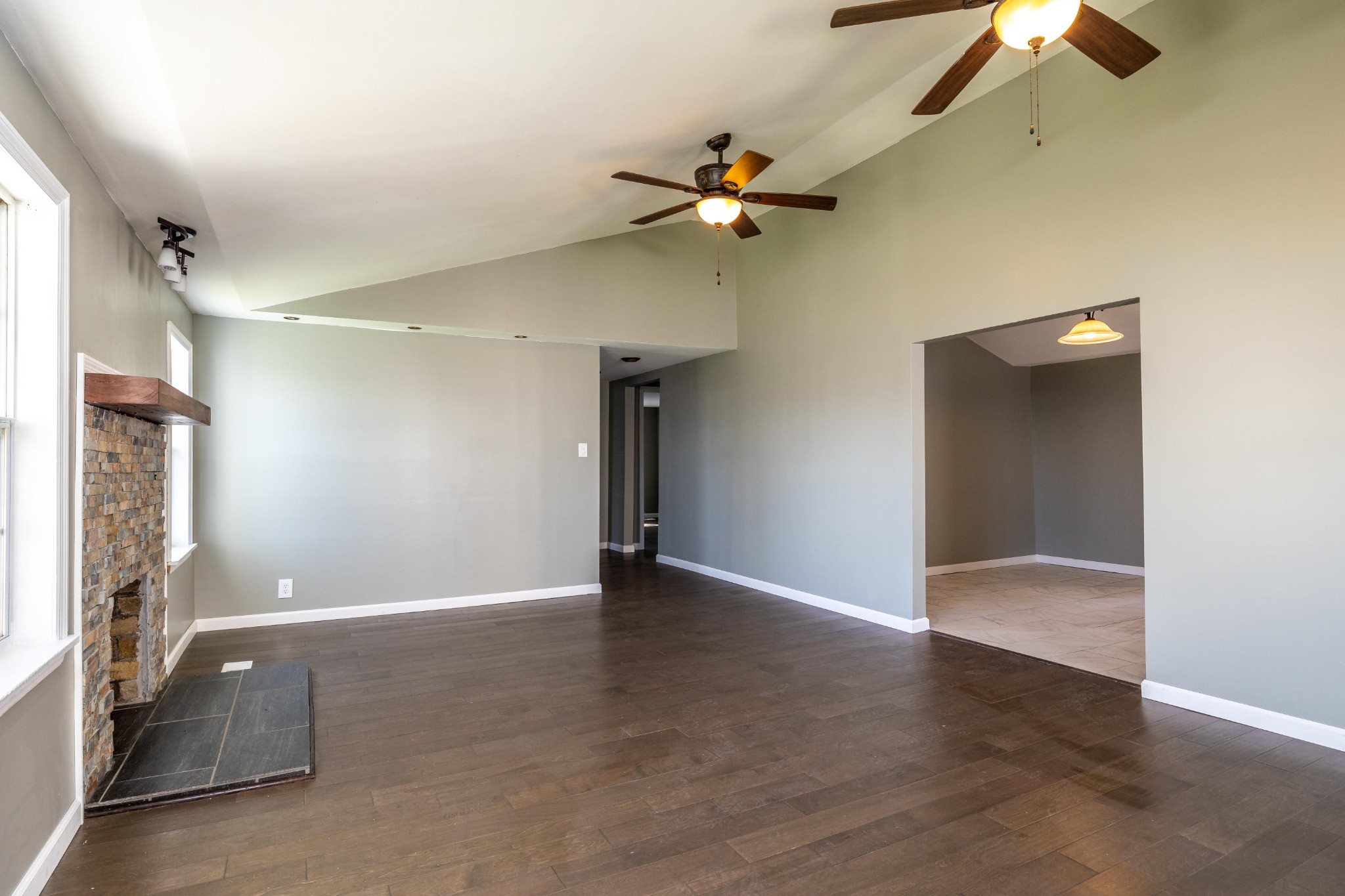 804 Spring Street Philadelphia, TN 37846 - Photo 4 of 33 a view of an empty room with a ceiling fan and a window