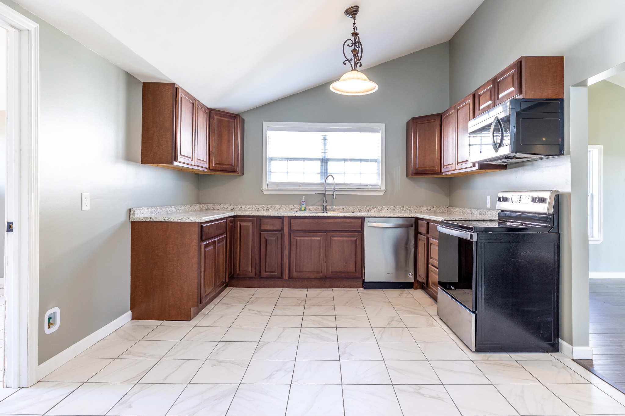 804 Spring Street Philadelphia, TN 37846 - Photo 10 of 33 a kitchen with stainless steel appliances granite countertop a stove cabinets and a sink