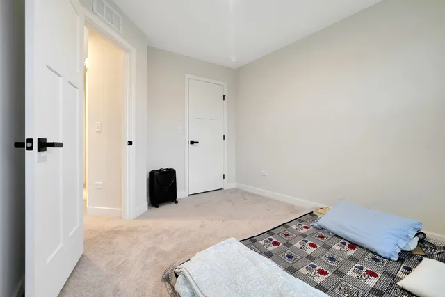 a bedroom with a bed and a baby