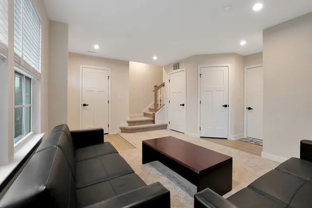 a room with lots of counter space and wooden floor