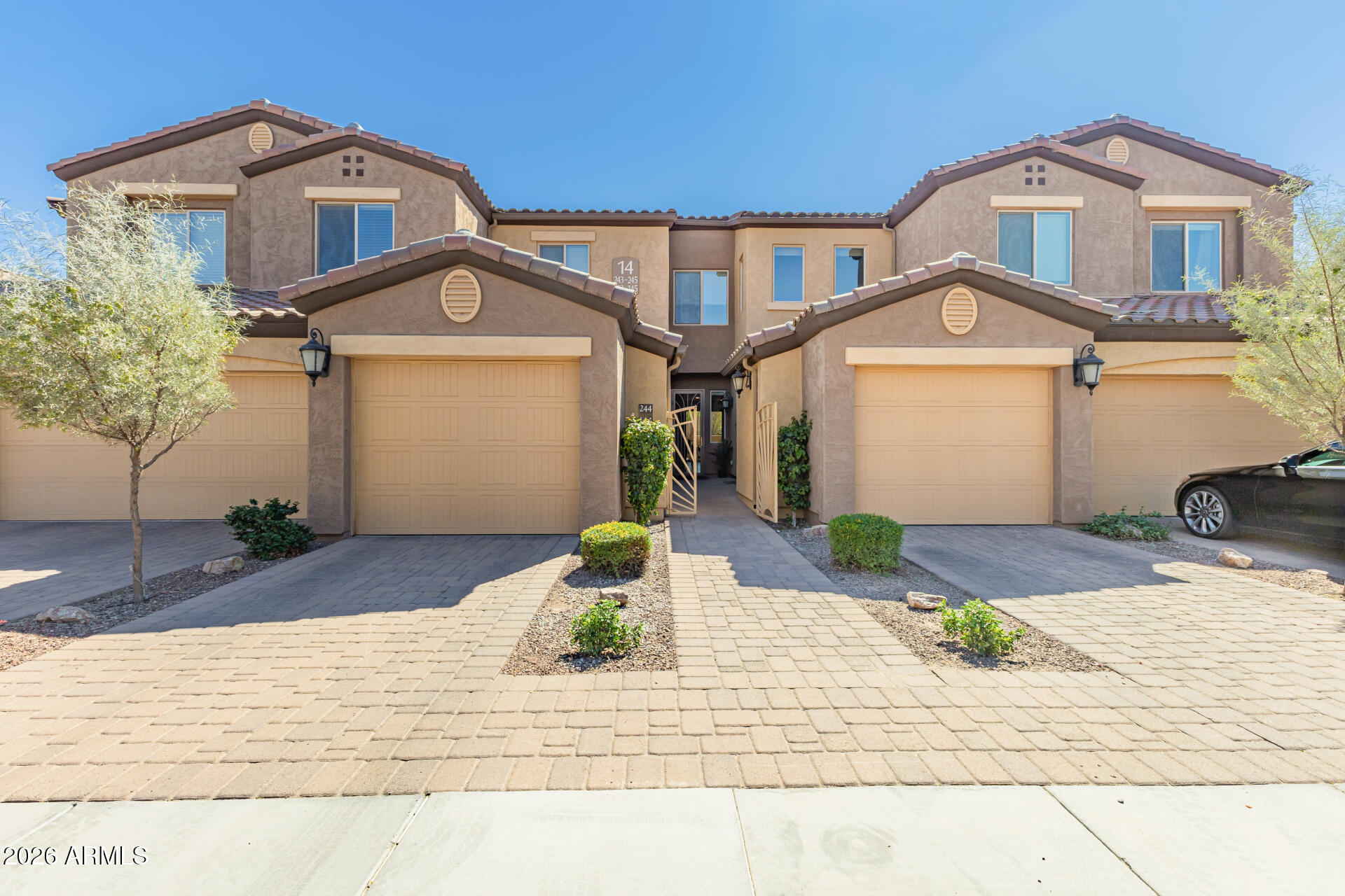 250 West Queen Creek Road, Unit 144 Chandler, AZ 85248 - Photo 1 of 33 a front view of a house with a yard