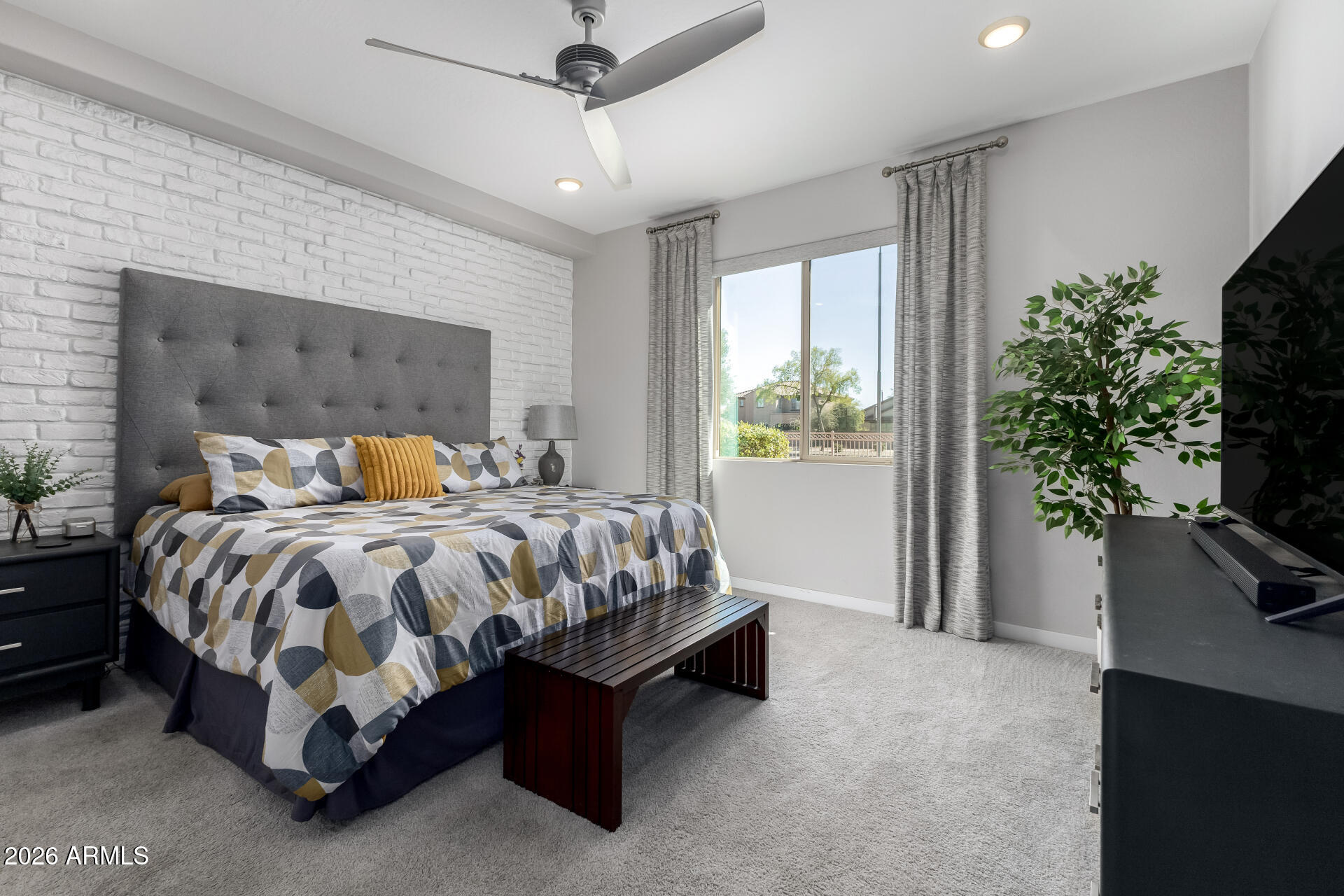 250 West Queen Creek Road, Unit 144 Chandler, AZ 85248 - Photo 11 of 33 a bed sitting in a spacious bedroom next to a window