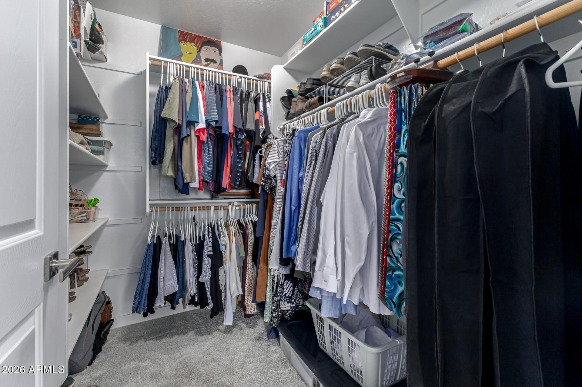 250 West Queen Creek Road, Unit 144 Chandler, AZ 85248 - Photo 15 of 33 a view of walk in closet with clothes