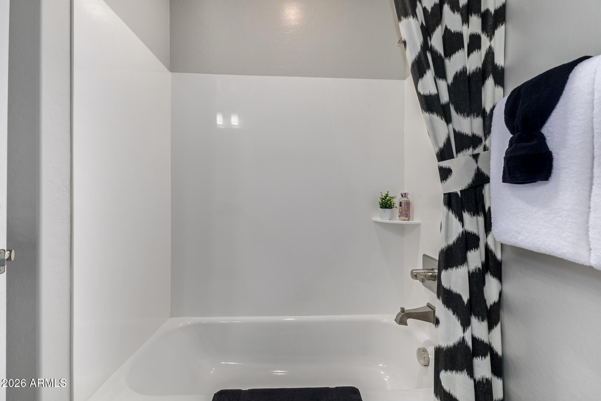 250 West Queen Creek Road, Unit 144 Chandler, AZ 85248 - Photo 19 of 33 a bathroom with a bathtub and shower