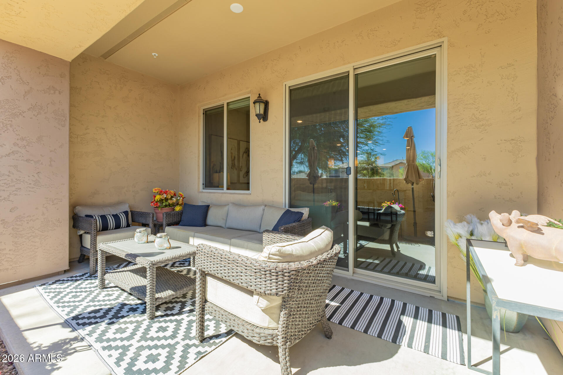 250 West Queen Creek Road, Unit 144 Chandler, AZ 85248 - Photo 22 of 33 a outdoor space with patio the couches and a dining table with garden view