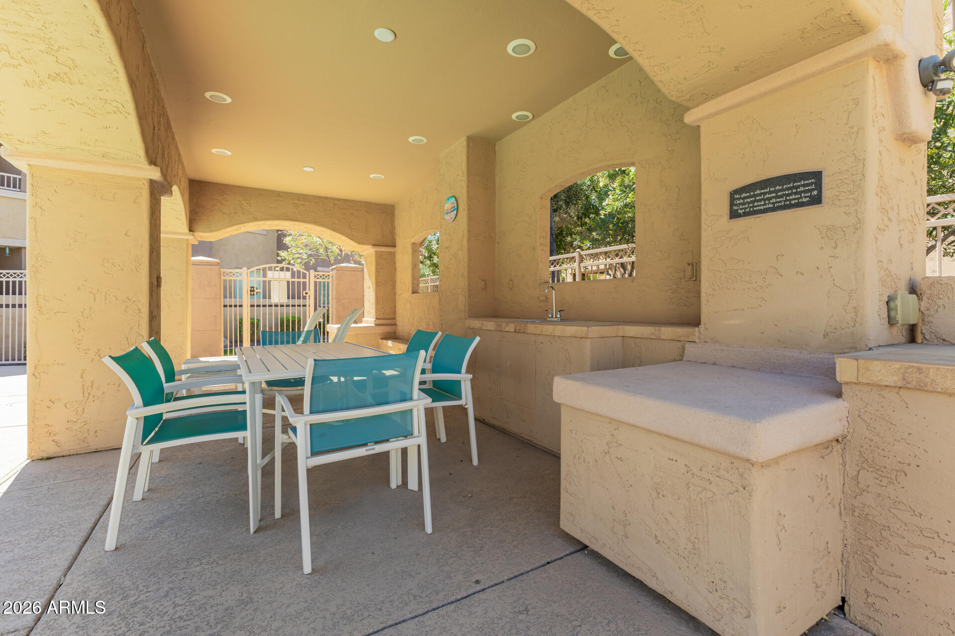250 West Queen Creek Road, Unit 144 Chandler, AZ 85248 - Photo 28 of 33 a dining room with a wooden table and chairs