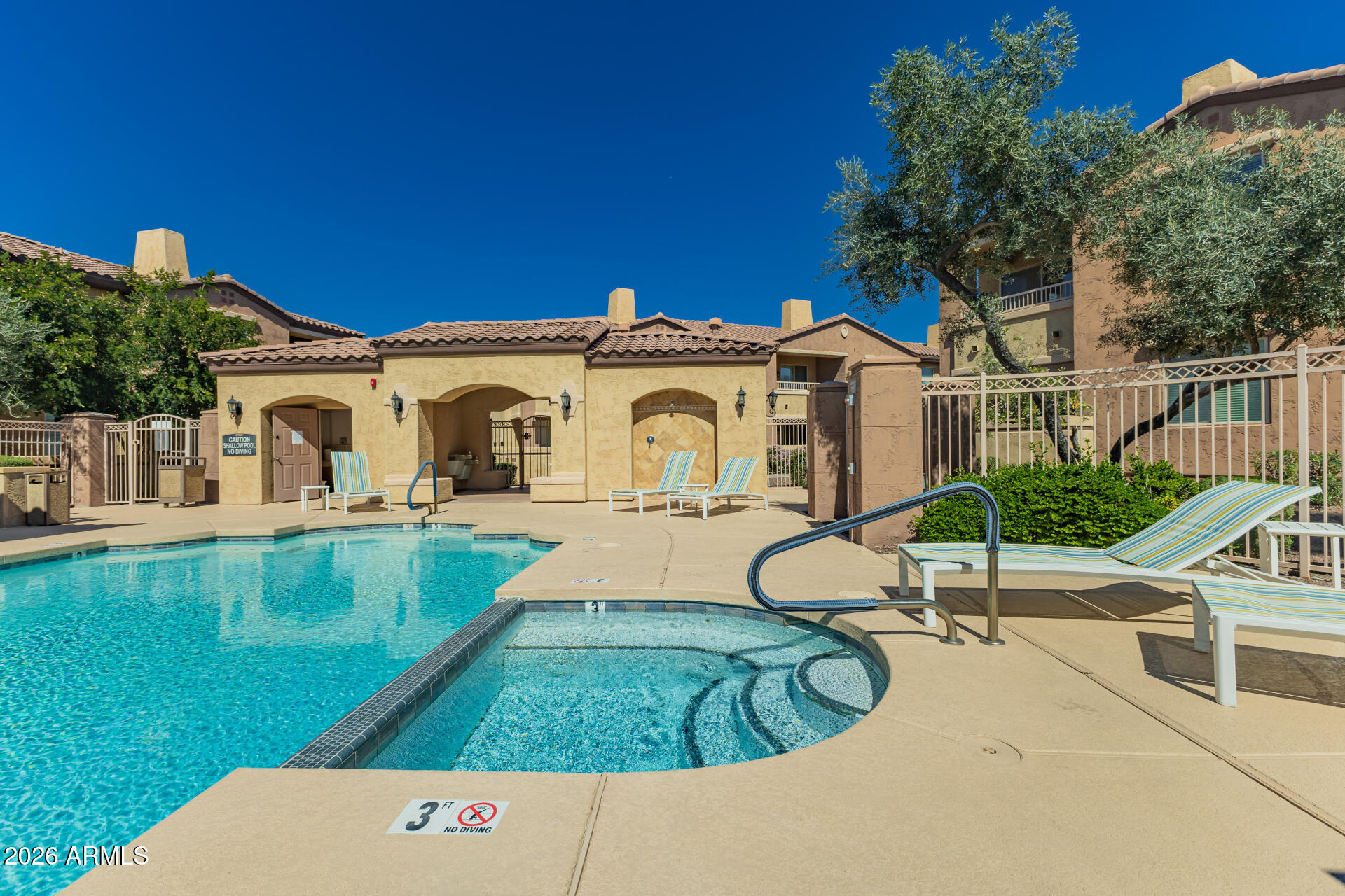 250 West Queen Creek Road, Unit 144 Chandler, AZ 85248 - Photo 33 of 33 a view of a white house with a swimming pool