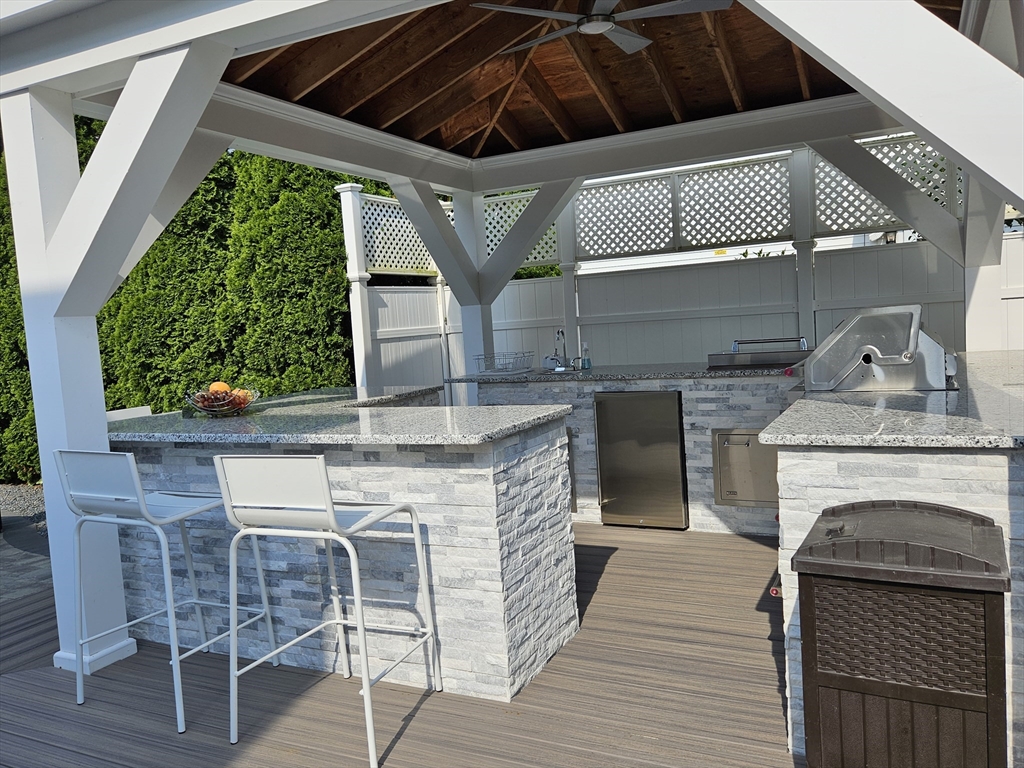 33 Barclay Street Fall River, MA 02724 - Photo 11 of 37 a kitchen with stainless steel appliances granite countertop a stove a sink and a refrigerator