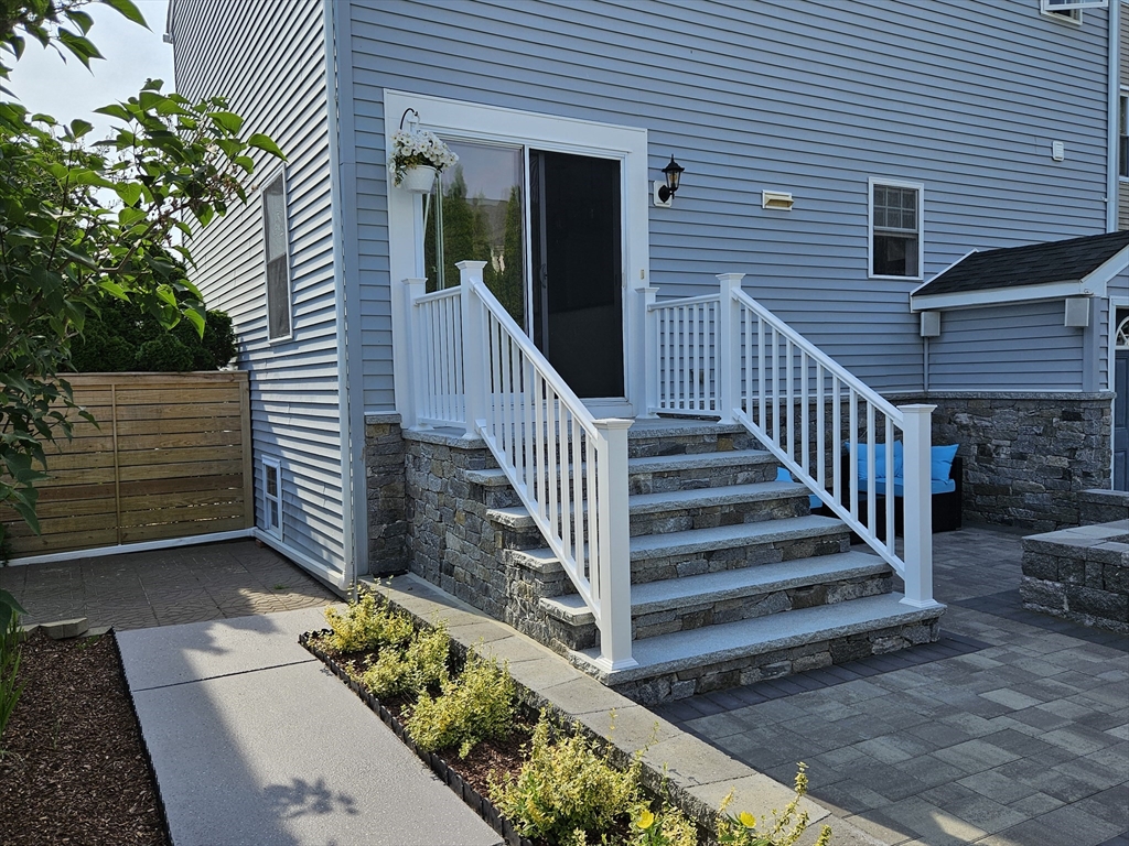 33 Barclay Street Fall River, MA 02724 - Photo 13 of 37 a view of a house with wooden fence
