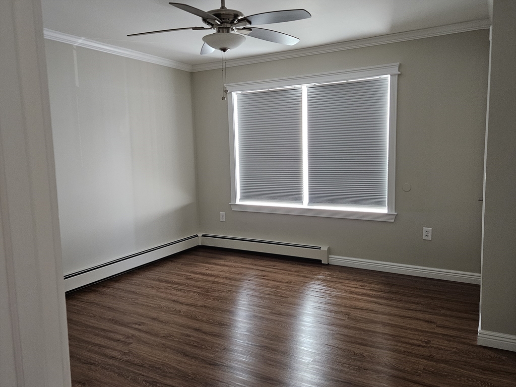 33 Barclay Street Fall River, MA 02724 - Photo 22 of 37 a view of an empty room with wooden floor and a window