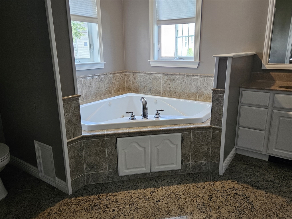 33 Barclay Street Fall River, MA 02724 - Photo 24 of 37 a bathroom with a bathtub and a sink