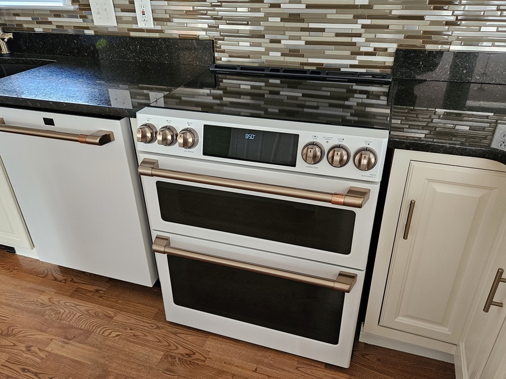 33 Barclay Street Fall River, MA 02724 - Photo 36 of 37 a close view of a stove and a microwave