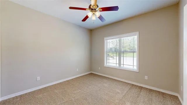 a view of bedroom with a hallway