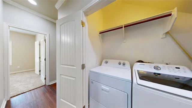 a bathroom with a granite countertop toilet sink and mirror