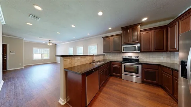 a front view of house with yard and trees