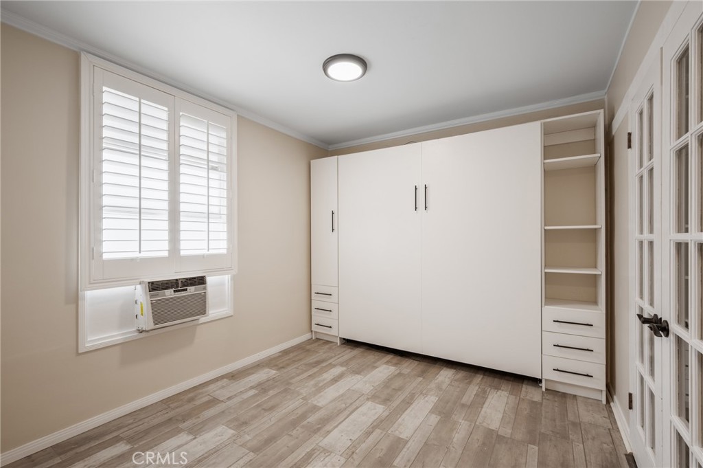 2025 Cloverfield Boulevard, Unit C Santa Monica, CA 90404 - Photo 14 of 36 a view of empty room with wooden floor and fan