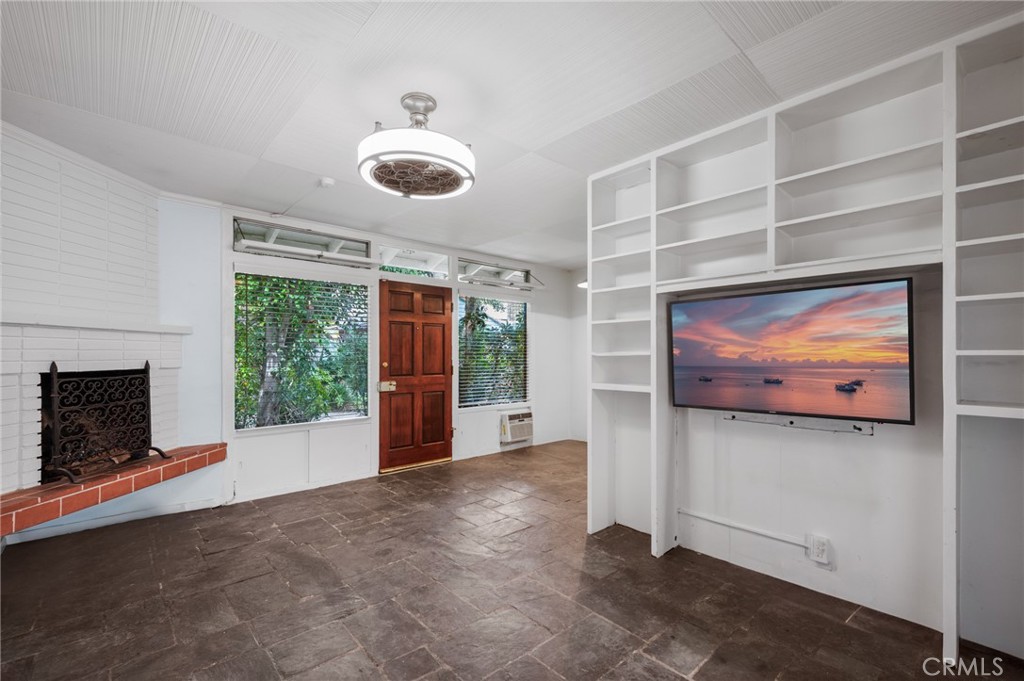 2025 Cloverfield Boulevard, Unit C Santa Monica, CA 90404 - Photo 17 of 36 a view of livingroom with furniture and fireplace