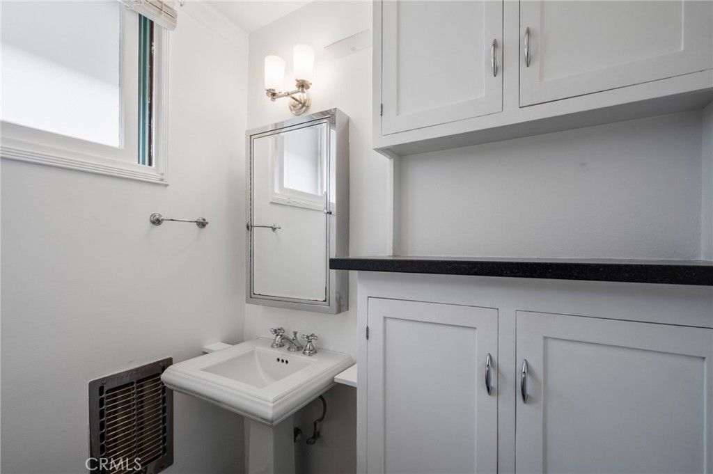2025 Cloverfield Boulevard, Unit C Santa Monica, CA 90404 - Photo 22 of 36 a bathroom with a sink and a mirror