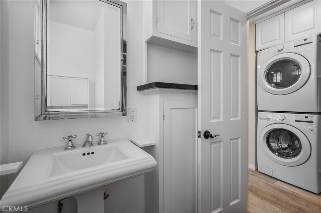 2025 Cloverfield Boulevard, Unit C Santa Monica, CA 90404 - Photo 24 of 36 a utility room with sink dryer and washer