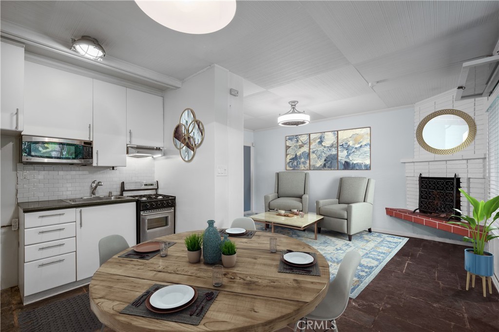 2025 Cloverfield Boulevard, Unit C Santa Monica, CA 90404 - Photo 10 of 36 a living room with furniture and a fireplace