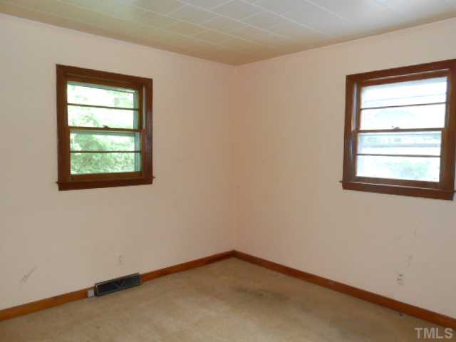 321 Gravitte Road Roxboro, NC 27573 - Photo 7 of 9 an empty room with a window